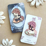 A pair of hard enamel pins featuring to mushroom fae folk.